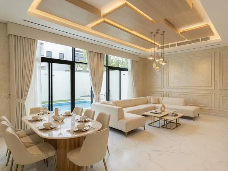 Layered floating ceiling panels with cove lighting over a living room